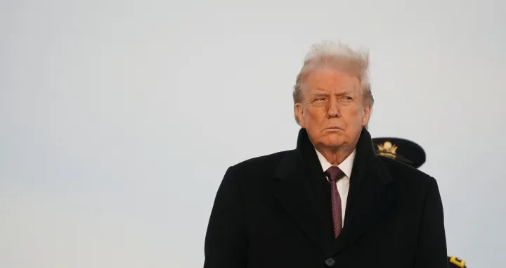 U.S. President Donald Trump participates in a dignified transfer of the remains of two Iowa National Guard members killed in Syria, Sgt. Edgar Torres Tovar and Sgt. William Howard, and Ayad Mansoor Sakat, of Macomb, Michigan, who was working as an interpreter in Syria, at Dover Air Force Base in Dover, Delaware, U.S., December, 17, 2025. REUTERS/Nathan Howard/Nathan Howard