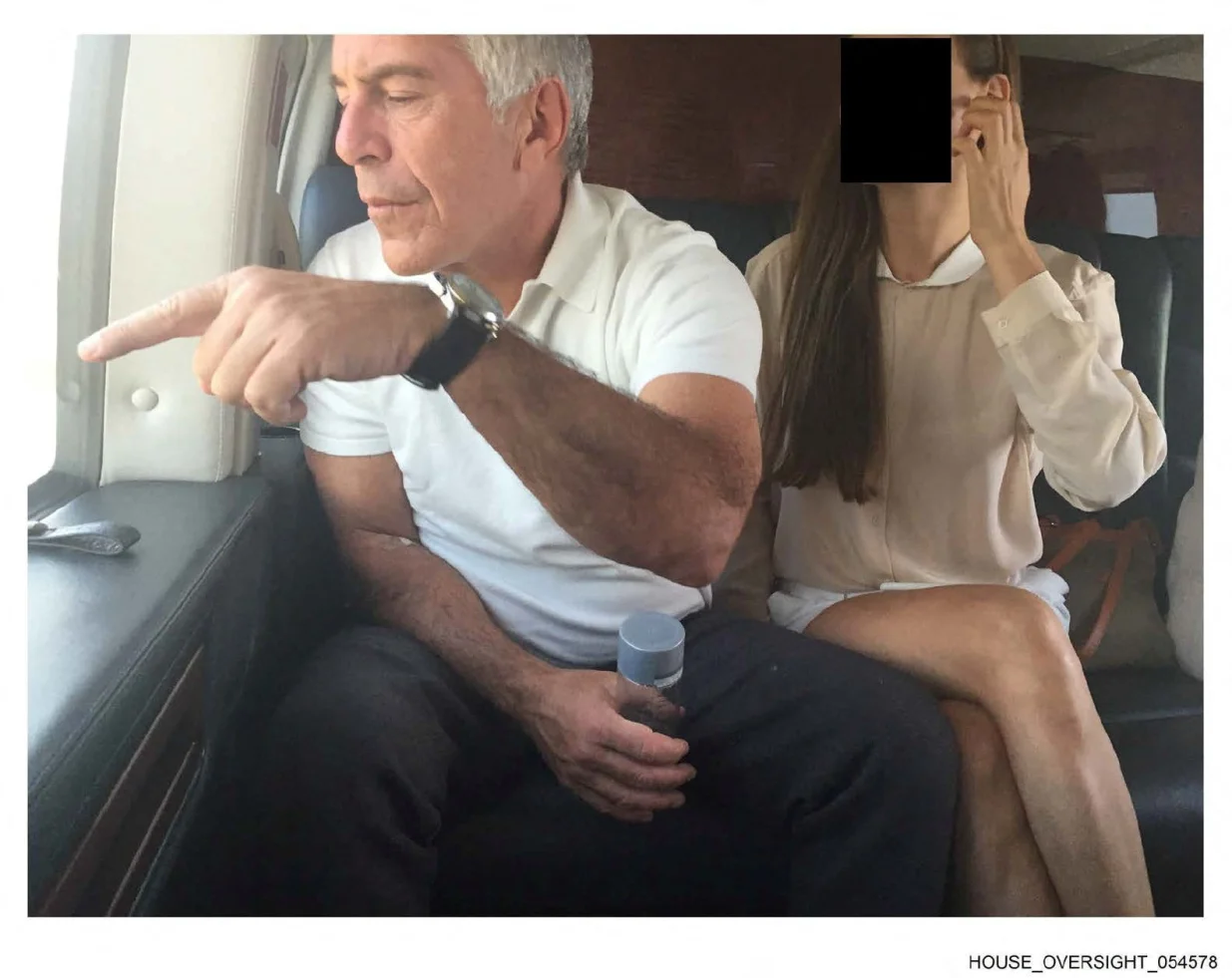 Late financier and convicted sex offender Jeffrey Epstein appears with a woman, who's identity has been obscured, in this image from the Epstein estate released by House Oversight Committee Democrats in Washington, D.C., U.S., on December 18, 2025. House Oversight Committee Democrats/Handout via REUTERS THIS IMAGE HAS BEEN SUPPLIED BY A THIRD PARTY. REDACTED AREA FROM SOURCE./House Oversight Committee Democr
