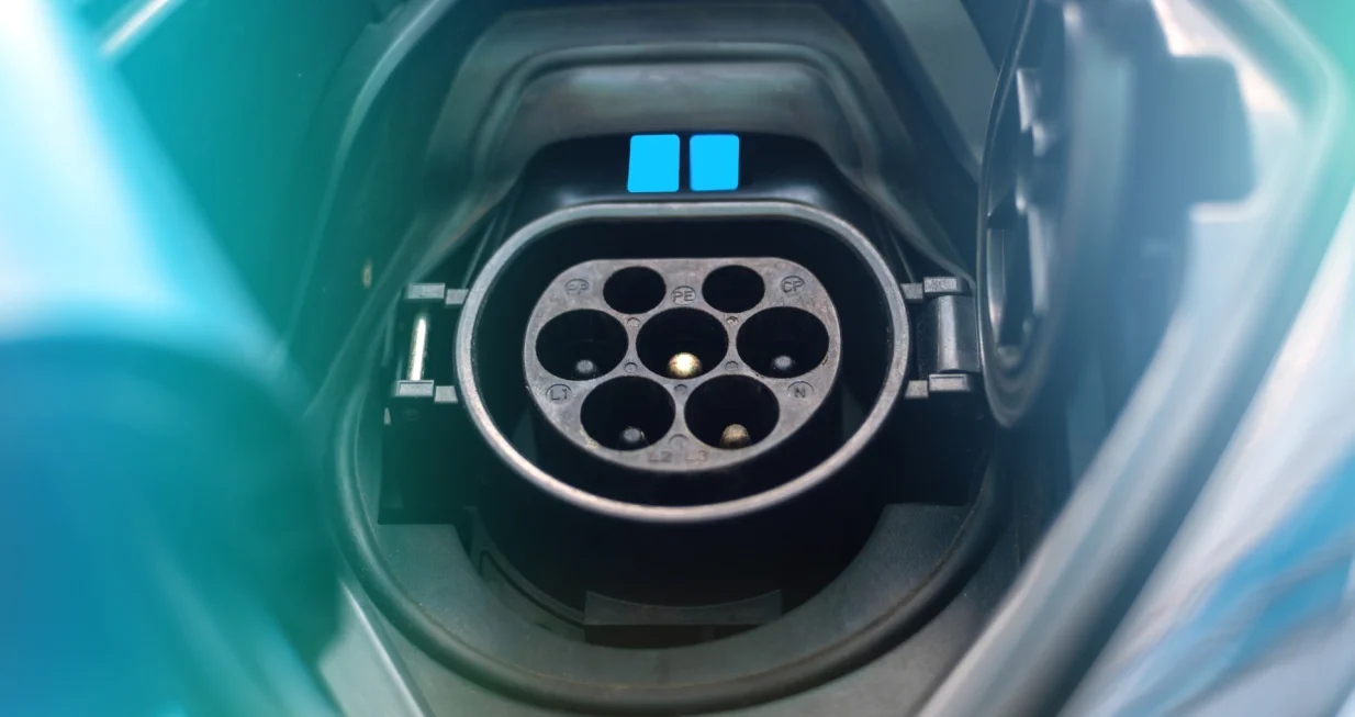 Charging socket of an el asdgadfg adfgasdf agagectric car with blue light/Frimu Eugen