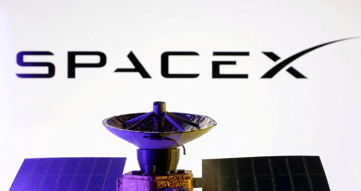 FILE PHOTO: SpaceX logo and miniature satellite model are seen in this illustration created on March 10, 2025. REUTERS/Dado Ruvic/Illustration/File Photo/File Photo/Dado Ruvic