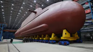 North Korean leader Kim Jong Un visits the construction site of an 8,700-ton nuclear-powered submarine capable of launching surface-to-air missiles in this picture released by North Korea's official Korean Central News Agency on December 25, 2025. KCNA via REUTERS ATTENTION EDITORS - THIS IMAGE WAS PROVIDED BY A THIRD PARTY. REUTERS IS UNABLE TO INDEPENDENTLY VERIFY THIS IMAGE. NO THIRD PARTY SALES. SOUTH KOREA OUT. NO COMMERCIAL OR EDITORIAL SALES IN SOUTH KOREA./Kcna