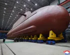 North Korean leader Kim Jong Un visits the construction site of an 8,700-ton nuclear-powered submarine capable of launching surface-to-air missiles in this picture released by North Korea's official Korean Central News Agency on December 25, 2025. KCNA via REUTERS ATTENTION EDITORS - THIS IMAGE WAS PROVIDED BY A THIRD PARTY. REUTERS IS UNABLE TO INDEPENDENTLY VERIFY THIS IMAGE. NO THIRD PARTY SALES. SOUTH KOREA OUT. NO COMMERCIAL OR EDITORIAL SALES IN SOUTH KOREA./Kcna