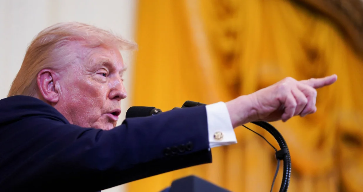 U.S. President Donald Trump gestures as he speaks at a Hanukkah reception in the East Room of the White House in Washington, D.C., U.S., December 16, 2025. REUTERS/Nathan Howard/Nathan Howard