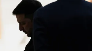 Ukrainian President Volodymyr Zelenskiy reacts as he gets the hall for a minute while he waits for U.S. President Donald Trump for meetings at Trump's Mar-a-Lago club in Palm Beach, Florida, U.S., December 28, 2025. REUTERS/Jonathan Ernst/Jonathan Ernst