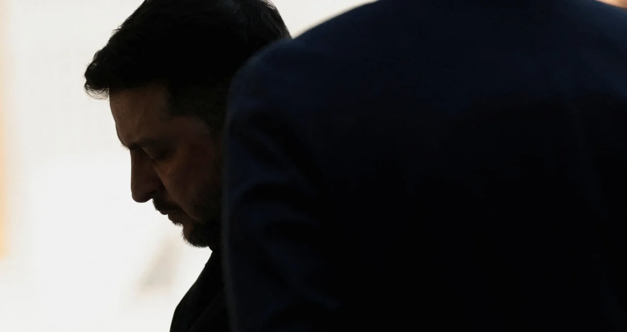 Ukrainian President Volodymyr Zelenskiy reacts as he gets the hall for a minute while he waits for U.S. President Donald Trump for meetings at Trump's Mar-a-Lago club in Palm Beach, Florida, U.S., December 28, 2025. REUTERS/Jonathan Ernst/Jonathan Ernst