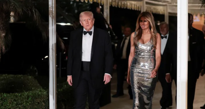 U.S. President Donald Trump and first lady Melania Trump arrive to attend a New Year's Eve party with members and guests at Trump's Mar-a-Lago Club in Palm Beach, Florida, U.S., December 31, 2025. REUTERS/Jonathan Ernst/Jonathan Ernst