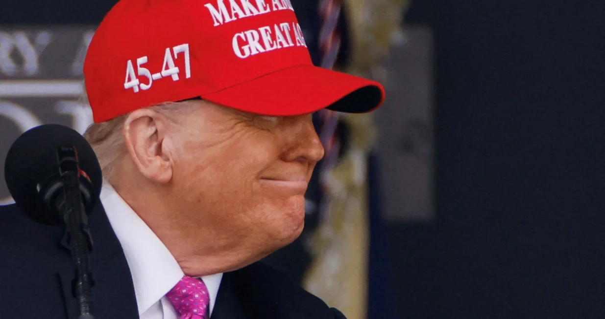 FILE PHOTO: U.S. President Donald Trump wears a 'Make America Great Again' (MAGA) hat as he attends the commencement ceremony at West Point Military Academy in West Point, New York, U.S., May 24, 2025. REUTERS/Eduardo Munoz/File Photo/Eduardo Munoz