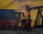 epa10138056 A mural at the Petroleo of Venezuela facilities, in Caracas, Venezuela, 17 August 2022 (Issued 25 August 2022). Venezuela's oil production, which fell 28 percent since December 2021 after a fleeting increase in the last months of 2021, is increasingly moving away from the goal set by the Venezuelan President of pumping two million barrels per day (bpd) at the end of the year, for which it requires a rise of 218 percent, compared to 629,000 bpd in July. EPA/MIGUEL GUTIERREZ/Miguel Gutierrez