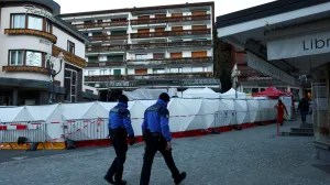 Swiss police officers walk outside the "Le Constellation" bar, after a fire and explosion during a New Year's Eve party where several people died, and others were injured, according to Swiss police, in the upscale ski resort of Crans-Montana in southwestern Switzerland, January 3, 2026. REUTERS/Denis Balibouse/Denis Balibouse