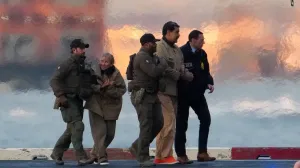 Law enforcement officials move captured Venezuelan President Nicolas Maduro and his wife Cilia Flores out of the helicopter, as Maduro heads towards the Daniel Patrick Manhattan United States Courthouse for an initial appearance to face U.S. federal charges including narco-terrorism, conspiracy, drug trafficking, money laundering and others in New York City, U.S., January 5, 2026. REUTERS/Adam Gray  TPX IMAGES OF THE DAY/Adam Gray