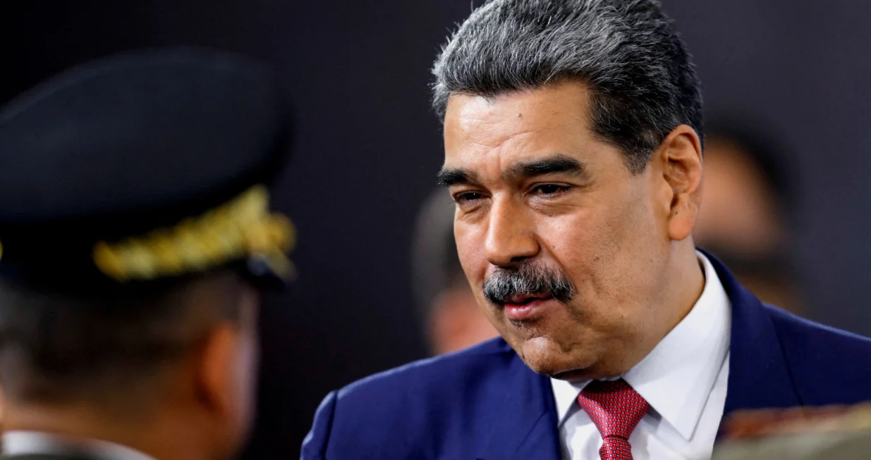FILE PHOTO: Venezuela's President Nicolas Maduro prepares to leave at the end of a press conference, days after he said Venezuela would deploy military, police and civilian defenses at 284 "battlefront" locations across the country, amid heightened tensions with the U.S., in Caracas, Venezuela, September 15, 2025. REUTERS/Leonardo Fernandez Viloria/File Photo/Leonardo Fernandez Viloria