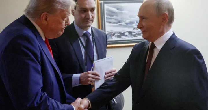 FILE PHOTO: U.S. President Donald Trump shakes hands with Russian President Vladimir Putin before a joint news conference following their meeting at Joint Base Elmendorf-Richardson in Anchorage, Alaska, U.S., August 15, 2025. Sputnik/Gavriil Grigorov/Pool via REUTERS ATTENTION EDITORS - THIS IMAGE WAS PROVIDED BY A THIRD PARTY./File Photo/Gavriil Grigorov