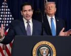 U.S. Secretary of State Marco Rubio speaks as U.S. President Donald Trump stands behind him during a press conference following a U.S. strike on Venezuela where President Nicolas Maduro and his wife, Cilia Flores, were captured, from Trump's Mar-a-Lago club in Palm Beach, Florida, U.S., January 3, 2026. REUTERS/Jonathan Ernst/Jonathan Ernst