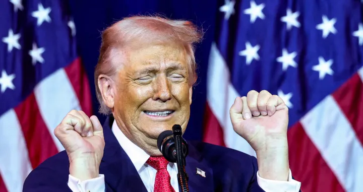 U.S. President Donald Trump gestures as he makes an impression of a transgender weightlifter during his address to House Republicans at their annual issues conference retreat at the Kennedy Center, renamed the Trump-Kennedy Centre by the Trump-appointed board of directors, in Washington, D.C., U.S., January 6, 2026. REUTERS/Kevin Lamarque/Kevin Lamarque