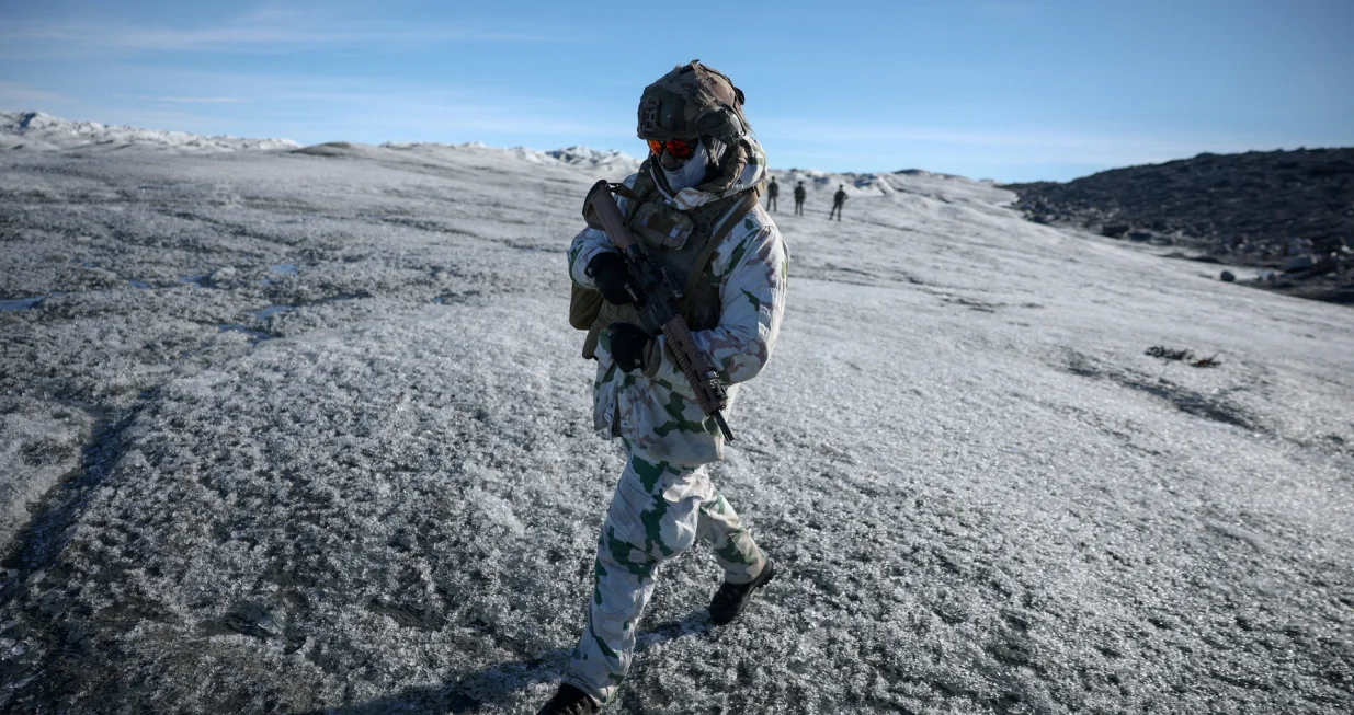 FILE PHOTO: A member of the French armed forces walks on ice during a military drill as Danish, Swedish and Norwegian home guard units together with Danish, German and French troops take part in joint military drills in Kangerlussuaq, Greenland, September 17, 2025. REUTERS/Guglielmo Mangiapane/File Photo/Guglielmo Mangiapane