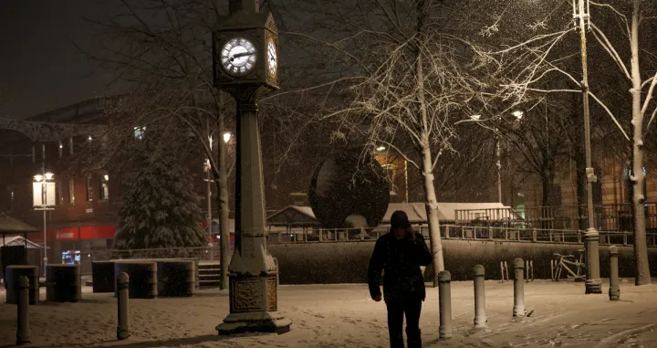 A person walks through the snow as Storm Goretti brings heavy snowfall and rain to Walsall, Britain, January 8, 2026. REUTERS/Isabel Infantes/Isabel Infantes