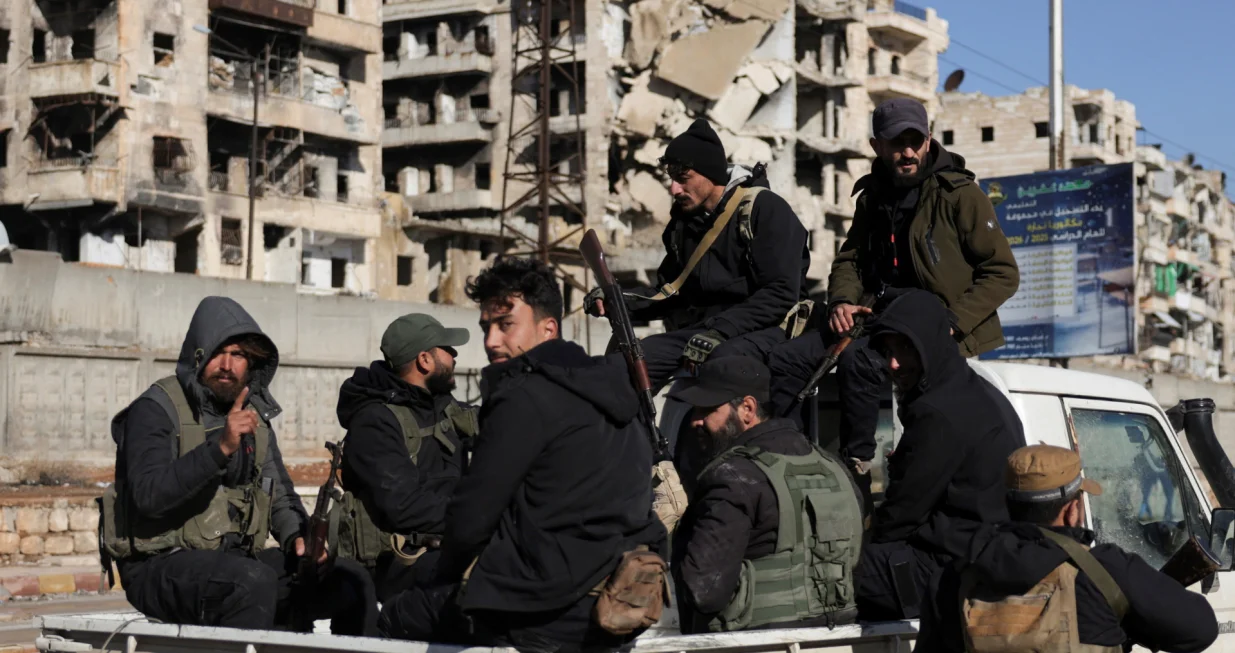 Members of the general security forces sit on a vehicle at the Sheikh Maksoud neighbourhood after taking control of the area, following the collapse of an agreement between the Syrian government and the Syrian Democratic Forces (SDF), in Aleppo, Syria, January 10, 2026. REUTERS/Khalil Ashawi/Khalil Ashawi