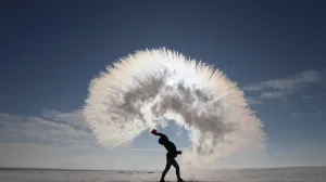 KARS, TURKEY - JANUARY 19: A woman throws hot water into the freezing cold air, at a temperature of minus 17 degrees Celcius in Kars, Turkey on January 19, 2020. (İsmail Kaplan - Anadolu Agency)/İsmail Kaplan