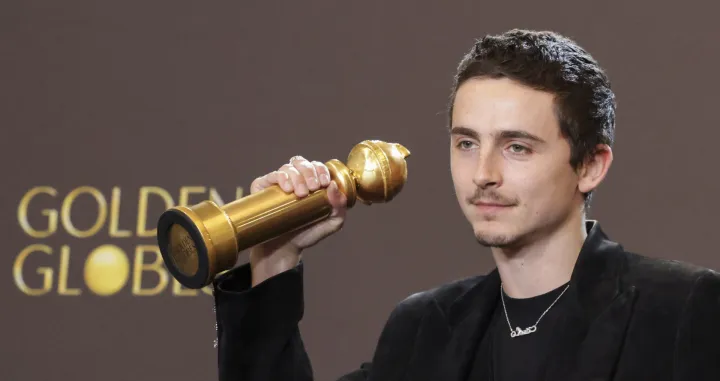 Timothee Chalamet poses with the Best Performance by a Male Actor in a Motion Picture - Musical or Comedy award for "Marty Supreme" at the 83rd Annual Golden Globes in Beverly Hills, California, U.S., January 11, 2026. REUTERS/Mario Anzuoni/Mario Anzuoni