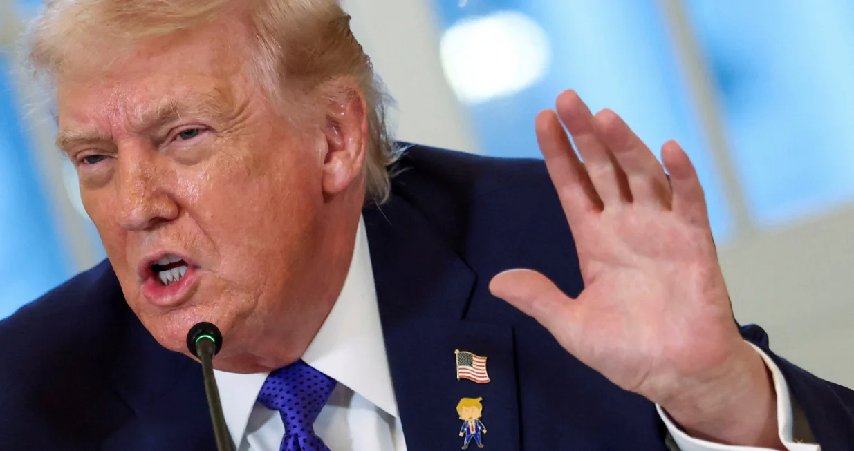 U.S. President Donald Trump wearing a "happy Trump" pin speaks during a meeting with oil industry executives at the White House in Washington, D.C., U.S., January 9, 2026. REUTERS/Kevin Lamarque/Kevin Lamarque