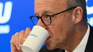 Christian Democratic Union (CDU) leader and German Chancellor Friedrich Merz drinks during the annual retreat of CSU federal lawmakers in the former monastery in Seeon, Germany, January 8, 2026. REUTERS/Angelika Warmuth/Angelika Warmuth