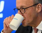Christian Democratic Union (CDU) leader and German Chancellor Friedrich Merz drinks during the annual retreat of CSU federal lawmakers in the former monastery in Seeon, Germany, January 8, 2026. REUTERS/Angelika Warmuth/Angelika Warmuth