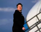 FILE PHOTO: Tesla CEO Elon Musk boards Air Force One with U.S. President Donald Trump (not pictured) as they depart for Philadelphia, Pennsylvania, from Morristown Municipal Airport in Morristown, New Jersey, U.S., March 22, 2025. REUTERS/Nathan Howard/File Photo/Nathan Howard