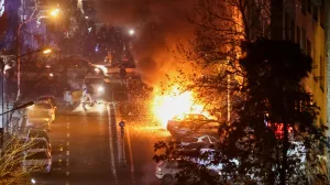 Cars burn in a street during a protest over the collapse of the currency's value, in Tehran, Iran, January 8, 2026. Stringer/WANA (West Asia News Agency) via REUTERS ATTENTION EDITORS - THIS PICTURE WAS PROVIDED BY A THIRD PARTY  TPX IMAGES OF THE DAY/Stringer