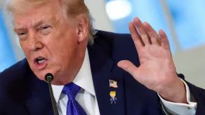 FILE PHOTO: U.S. President Donald Trump wearing a "happy Trump" pin speaks during a meeting with oil industry executives at the White House in Washington, D.C., U.S., January 9, 2026. REUTERS/Kevin Lamarque/File Photo/Kevin Lamarque