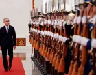Canada's Prime Minister Mark Carney reviews the honour guard at an official welcoming ceremony, during the first visit by a Canadian prime minister to China since 2017, at the Great Hall of the People in Beijing, China January 15, 2026. REUTERS/Carlos Osorio/Carlos Osorio