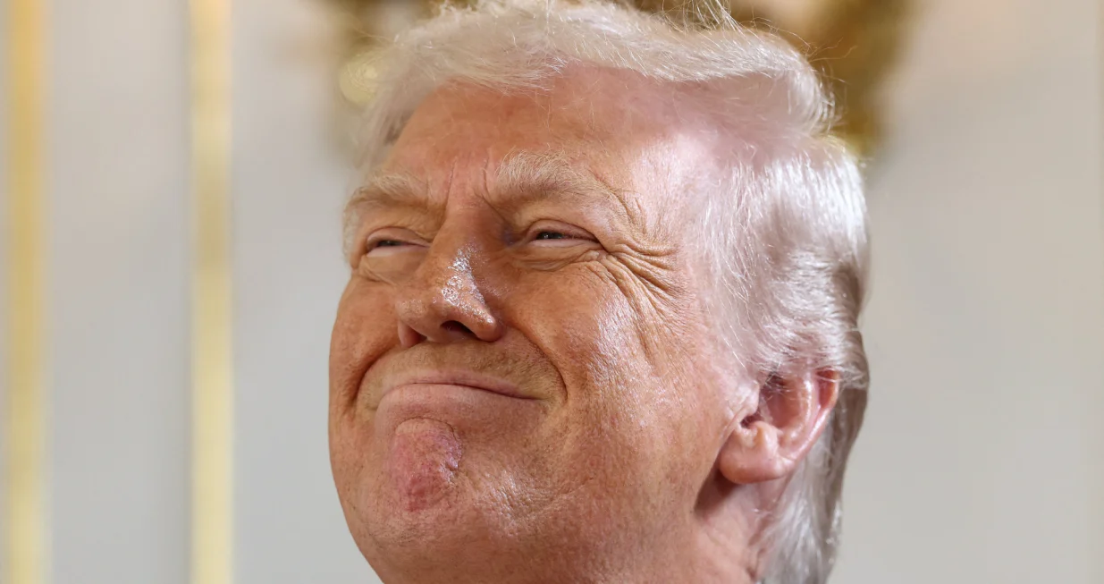 U.S. President Donald Trump reacts, as he attends a ceremony held to dedicate a 4-mile stretch of road from West Palm Beach Airport to his Mar-a-Lago estate as 'President Donald J. Trump Boulevard', at the Mar-a-Lago estate in Palm Beach, Florida, U.S., January 16, 2026. REUTERS/Kevin Lamarque/Kevin Lamarque