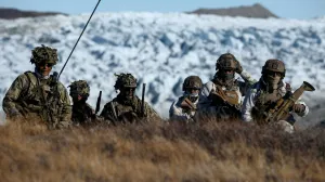FILE PHOTO: Danish troops practice looking for potential threats during a military drill as Danish, Swedish and Norwegian home guard units together with Danish, German and French troops take part in joint military drills in Kangerlussuaq, Greenland, September 17, 2025. REUTERS/Guglielmo Mangiapane/File Photo/Guglielmo Mangiapane