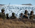 FILE PHOTO: Danish troops practice looking for potential threats during a military drill as Danish, Swedish and Norwegian home guard units together with Danish, German and French troops take part in joint military drills in Kangerlussuaq, Greenland, September 17, 2025. REUTERS/Guglielmo Mangiapane/File Photo/Guglielmo Mangiapane