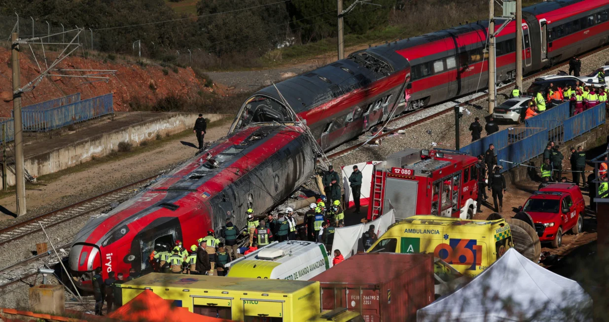 Members of the Spanish Civil Guard, along with other emergency personnel, work next to one of the trains&nbsp;involved in the accident, at the site of a deadly derailment of two high-speed trains near Adamuz, in Cordoba, Spain, January 19, 2026. REUTERS/Susana Vera  TPX IMAGES OF THE DAY/Susana Vera