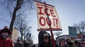 FILE PHOTO: Demonstrators carry signs condemning Immigration and Customs Enforcement (ICE) near the site where a man identified as Alex Pretti was fatally shot by federal agents trying to detain him, in Minneapolis, Minnesota, U.S., January 24, 2026. REUTERS/Tim Evans/File Photo/Tim Evans