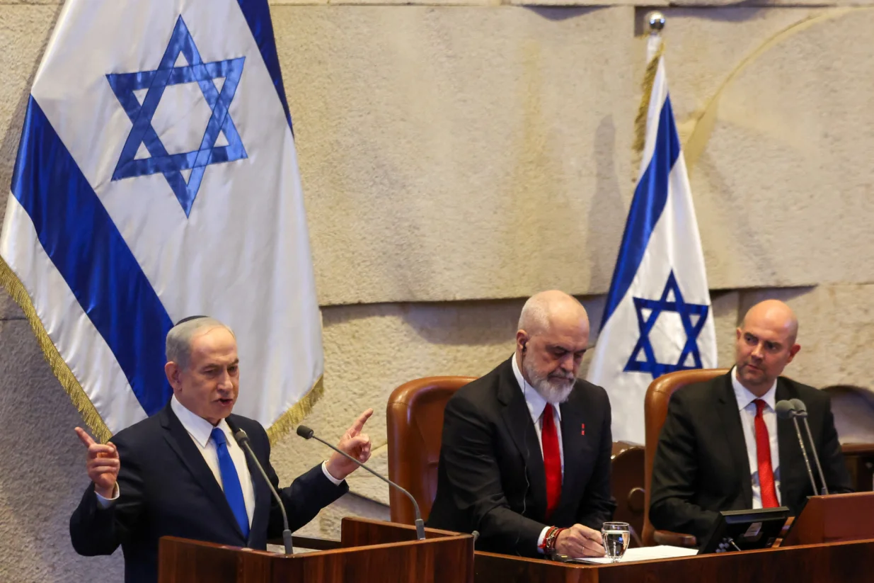 Israeli Prime Minister Benjamin Netanyahu speaks at the plenum of the Knesset, next to Albania's Prime Minister Edi Rama, in Jerusalem, January 26, 2026. REUTERS/Ronen Zvulun/Ronen Zvulun