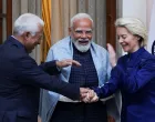 European Council President Antonio Costa, European Commission President Ursula von der Leyen and Indian Prime Minister Narendra Modi hold hands as they pose during a photo opportunity ahead of their meeting at the Hyderabad House in New Delhi, India, January 27, 2026. REUTERS/Altaf Hussain/Altaf Hussain