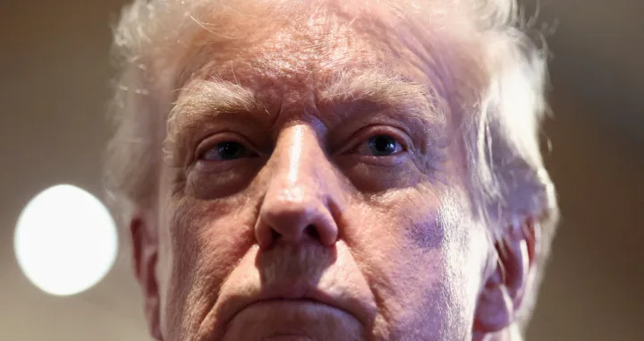 U.S. President Donald Trump looks on as he visits Machine Shed restaurant in Urbandale, Iowa, U.S., January 27, 2026. REUTERS/Kevin Lamarque  TPX IMAGES OF THE DAY/Kevin Lamarque