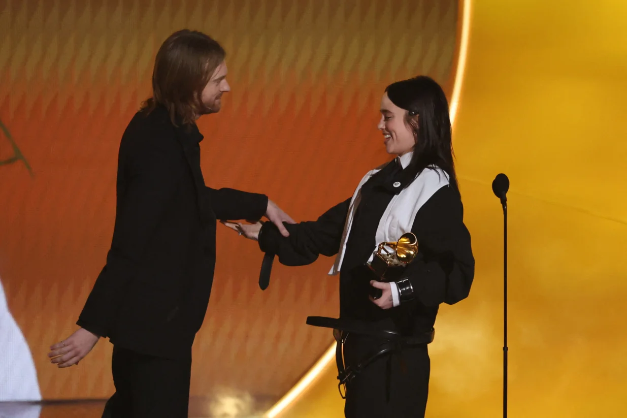 Billie Eilish accepts the award for Song of the Year for "WILDFLOWER" as Finneas reacts during the 68th Annual Grammy Awards in Los Angeles, California, U.S., February 1, 2026. REUTERS/Daniel Cole/Daniel Cole