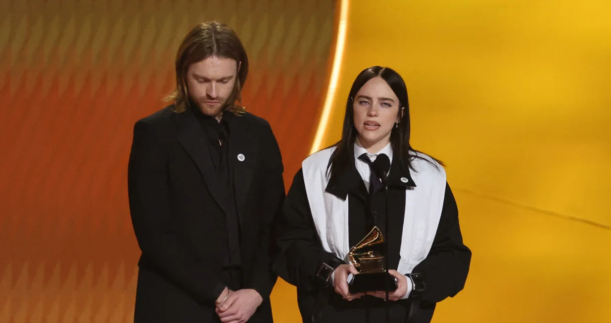 Billie Eilish accepts the award for Song of the Year for "WILDFLOWER" as Finneas looks on during the 68th Annual Grammy Awards in Los Angeles, California, U.S., February 1, 2026. REUTERS/Daniel Cole/Daniel Cole