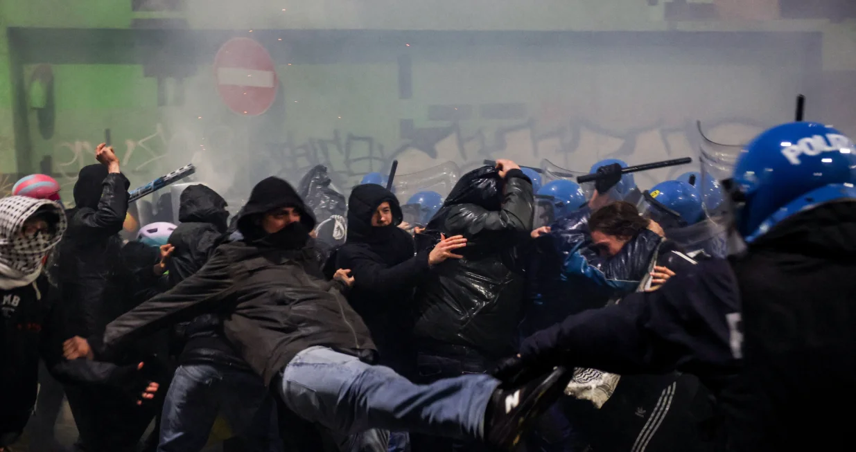 Police officers clash with demonstrators, as they were trying to block a road leading to the Santa Giulia Arena, on the day of a protest against the environmental, economic and social impact of the Milano-Cortina 2026 Winter Olympics, in Milan, Italy, February 7, 2026. REUTERS/Claudia GrecoвЂЁ/Claudia Greco