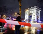 Police officer stands guard as law enforcement operate a cordon after authorities said a man armed with a knife attacked a police officer near the Arc de Triomphe in Paris, France, February 13, 2026. REUTERS/Benoit Tessier/Benoit Tessier