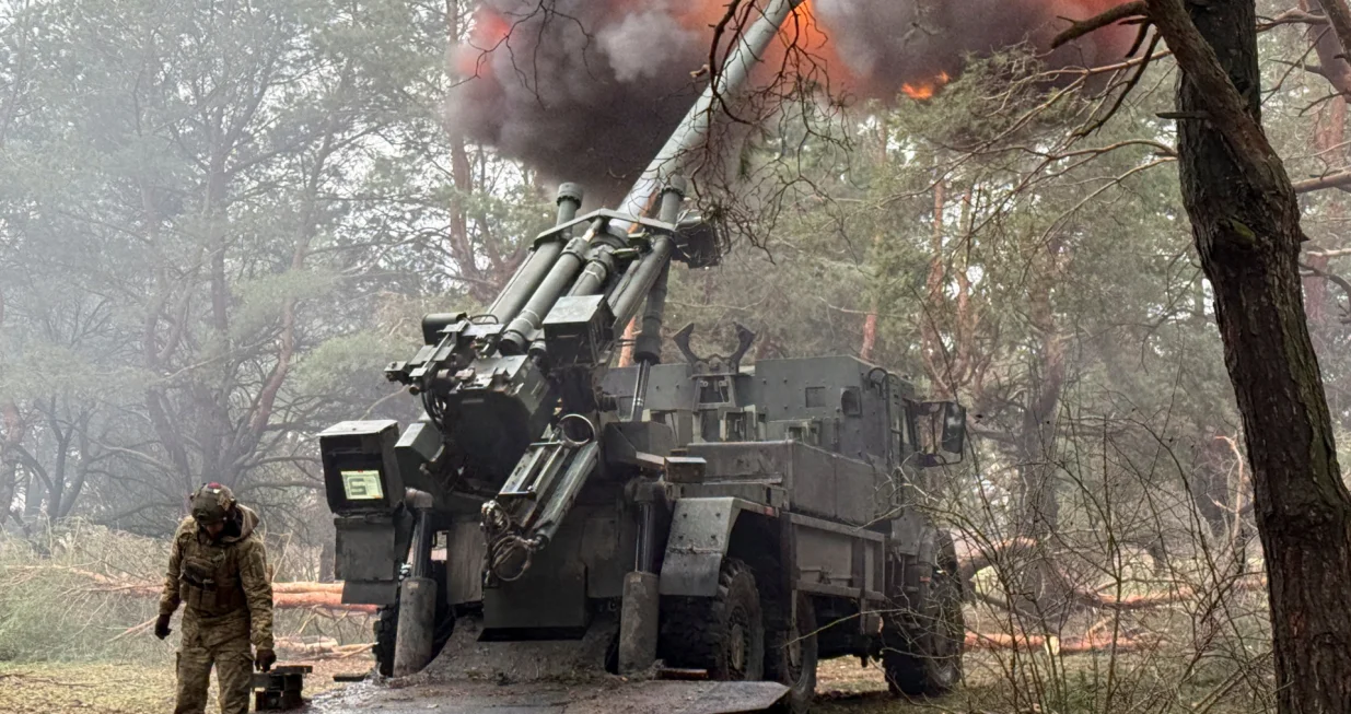 Ukrainian servicemen fire a Caesar self-propelled howitzer towards Russian troops at a position on the front line, amid Russia's attack on Ukraine, in Zaporizhzhia region, Ukraine February 16, 2026. Picture taken with a mobile phone. REUTERS/Stringer/Stringer