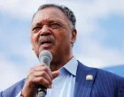 FILE PHOTO: Reverend Jesse Jackson speaks to protesters who gathered to memorialize George Floyd, who died in Minneapolis police custody, at the scene of his arrest in Minneapolis, Minnesota, U.S. June 4, 2020. REUTERS/Adam Bettcher/File Photo/Adam Bettcher