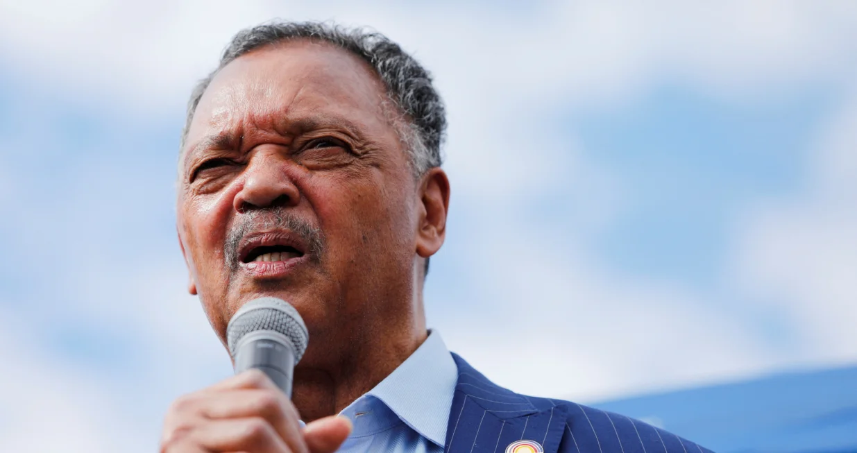 FILE PHOTO: Reverend Jesse Jackson speaks to protesters who gathered to memorialize George Floyd, who died in Minneapolis police custody, at the scene of his arrest in Minneapolis, Minnesota, U.S. June 4, 2020. REUTERS/Adam Bettcher/File Photo/Adam Bettcher
