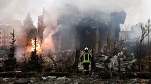 Firefighters work at the site of a residential building damaged during Russian drone and missile strikes, amid Russia's attack on Ukraine, in Kyiv, Ukraine, February 22, 2026. REUTERS/Valentyn Ogirenko  TPX IMAGES OF THE DAY/Valentyn Ogirenko