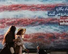 Iranian women walk past an anti-U.S. billboard in Tehran, Iran, February 19, 2026. Majid Asgaripour/WANA (West Asia News Agency) via REUTERS ATTENTION EDITORS - THIS PICTURE WAS PROVIDED BY A THIRD PARTY/Majid Asgaripour