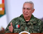 Mexico's Defense Minister Ricardo Trevilla Trejo speaks during a press conference about the wave of violence in Mexico, following the killing of Mexican drug lord Nemesio Oseguera, known as 'El Mencho', in a military operation on Sunday, at Palacio Nacional, in Mexico City, Mexico, February 23, 2026. REUTERS/Raquel Cunha/Raquel Cunha