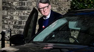 FILE PHOTO: Former British Ambassador to the U.S. Peter Mandelson enters a vehicle outside a reported residence, after police launched a misconduct in public office investigation following the release of U.S. Justice Department files linked to the late financier and convicted sex offender Jeffrey Epstein, in London, Britain, February 14, 2026. REUTERS/Chris Ratcliffe/Chris J Ratcliffe