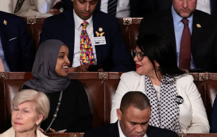  SENSITIVE MATERIAL. THIS IMAGE MAY OFFEND OR DISTURB U.S. Representative Rashida Tlaib (D-MI) wears a "Fuck ICE" pin as she sits next to U.S. Representative Ilhan Omar (D-MN) during U.S. President Donald Trump's State of the Union address to a joint session of Congress at the U.S. Capitol in Washington, D.C., U.S., February 24, 2026. REUTERS/Evelyn Hockstein/Evelyn Hockstein
